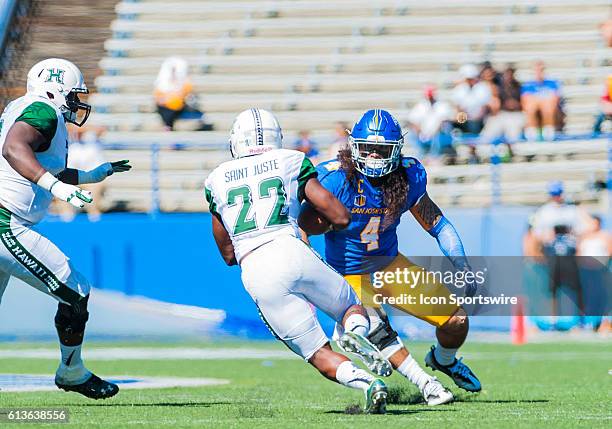 San Jose State Spartans linebacker Christian Tago stops Hawaii Warriors running back Diocemy Saint Juste in his tracks during the Mountain West...