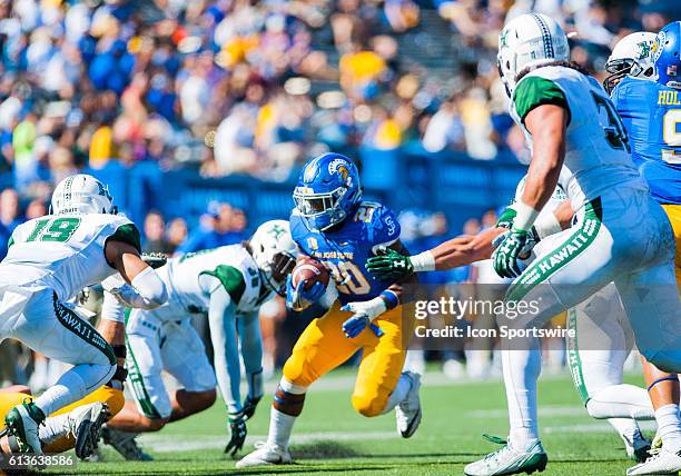 San Jose State Spartans running back Malik Roberson tries to get past Hawaii Warriors defenders during the Mountain West Conference game between San...