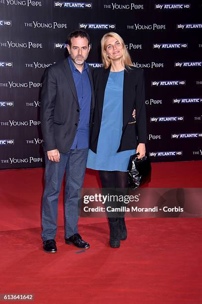 Fausto Brizzi and Claudia Zanella walk the red carpet at 'The Young Pope' premiere on October 9, 2016 in Rome, Italy.