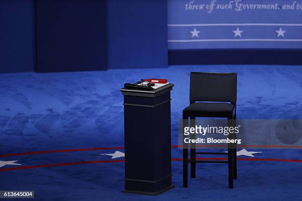 An empty seat and podium stands on stage ahead of the second U.S. Presidential debate at Washington University in St. Louis, Missouri, U.S., on...