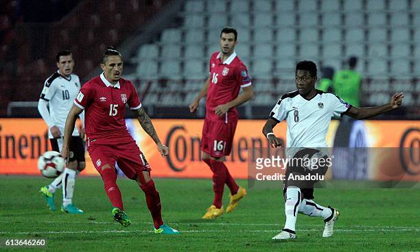 Ljubomir Fejsa of Serbia is in action against David Alaba of Austria during the FIFA 2018 World Cup Qualifier between Serbia and Austria at Rajko...