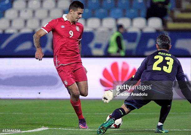 Aleksandar Mitrovic of Serbia is in action against Ramazan Ozcan of Austria during the FIFA 2018 World Cup Qualifier between Serbia and Austria at...