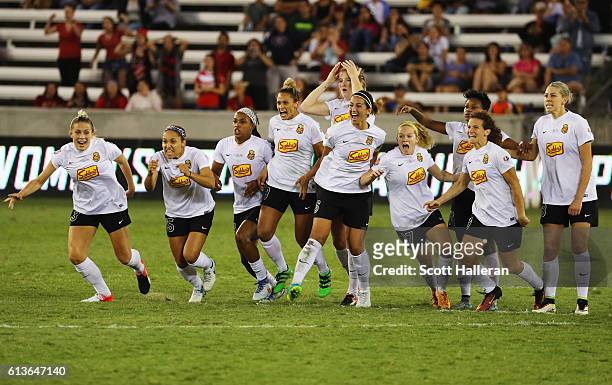 Members of the Western New York Flash celebrate after defeating the Washington Spirit in a shootout during the first half of the 2016 NWSL...