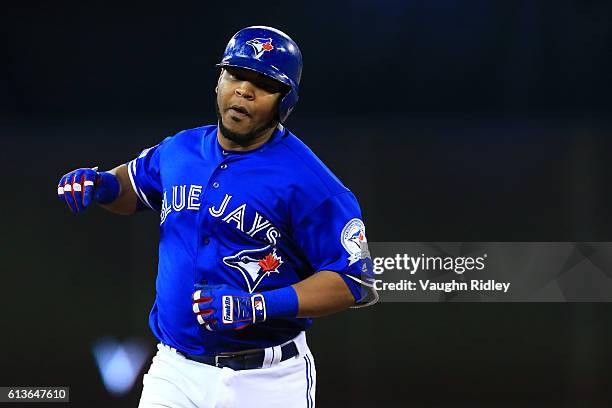 Edwin Encarnacion of the Toronto Blue Jays runs the bases after hitting a two run home run in the first inning against the Texas Rangers during game...