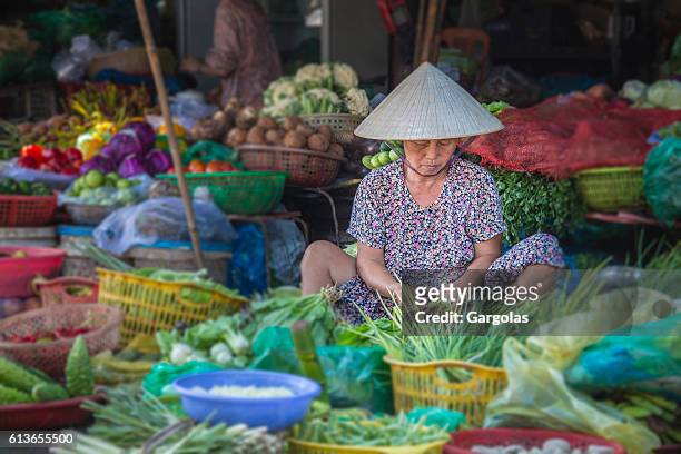 woman selling vegetables in hue market, vietnam - hot vietnamese women stock pictures, royalty-free photos & images
