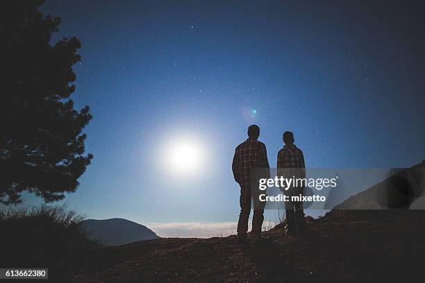 father with son in nature at night - boy rear bildbanksfoton och bilder