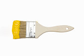 Paintbrush with yellow paint