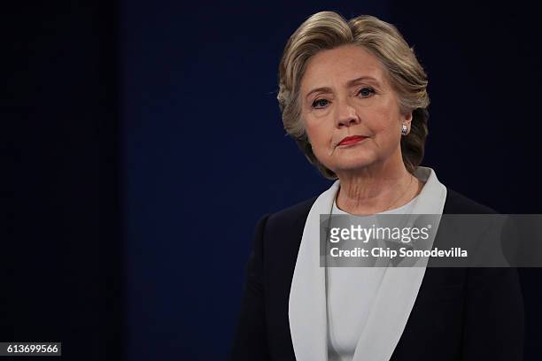 Democratic presidential nominee former Secretary of State Hillary Clinton listens to a question during the town hall debate at Washington University...