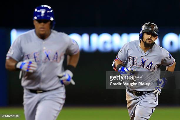 Rougned Odor of the Texas Rangers runs the bases after hitting a two run home run in the fourth inning against the Toronto Blue Jays during game...