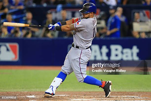 Rougned Odor of the Texas Rangers hits a two run home run in the fourth inning against the Toronto Blue Jays during game three of the American League...