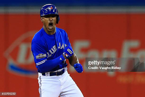Melvin Upton Jr. #7 of the Toronto Blue Jays celebrates after hitting a double against the Texas Rangers in the sixth inning during game three of the...