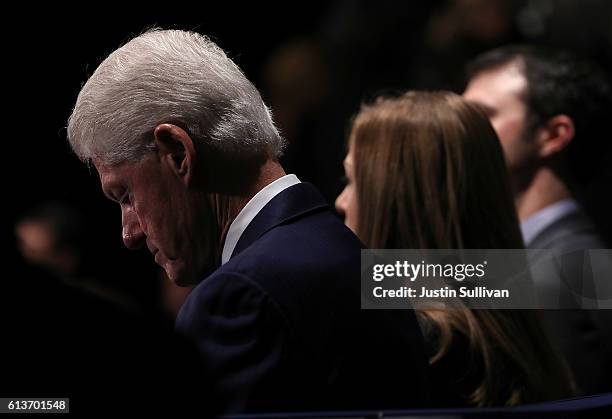 Former U.S. President Bill Clinton looks on during the second presidential debate with democratic presidential nominee former Secretary of State...