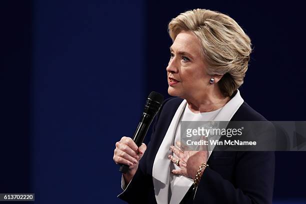 Democratic presidential nominee former Secretary of State Hillary Clinton responds to a question during the town hall debate at Washington University...