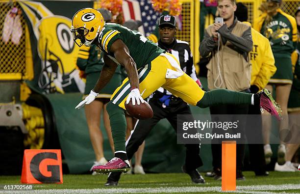 Davante Adams of the Green Bay Packers scores a touchdown in the second quarter against the New York Giants at Lambeau Field on October 9, 2016 in...