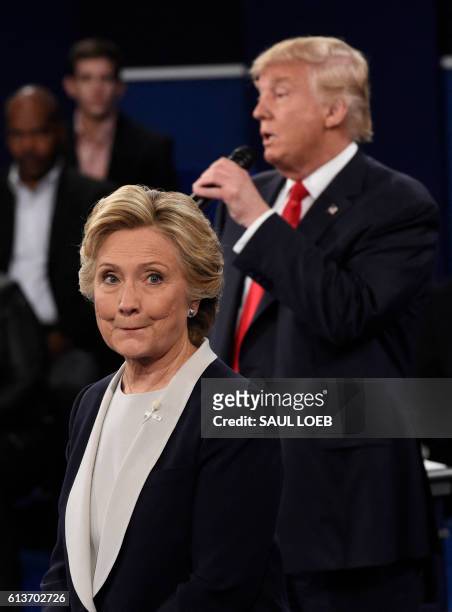 Republican Presidential nominee Donald Trump participate in a town hall debate against Democratic nominee Hillary Clinton at Washington University in...