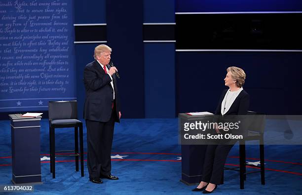 Republican presidential nominee Donald Trump speaks as Democratic presidential nominee former Secretary of State Hillary Clinton listens during the...
