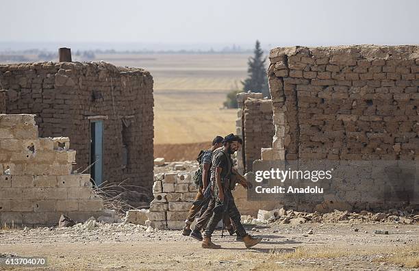 Members of opponent groups linked to Free Syrian Army patrol after they freed Mregil, Suveyrin and Rail villages from Daesh terrorists during the...