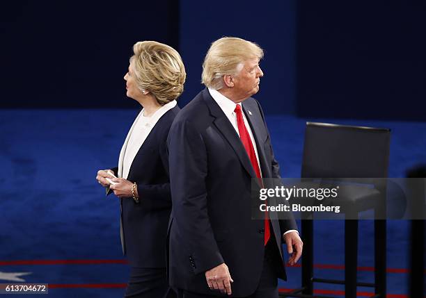 Hillary Clinton, 2016 Democratic presidential nominee, and Donald Trump, 2016 Republican presidential nominee, stand on stage during the second U.S....