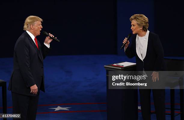 Donald Trump, 2016 Republican presidential nominee, and Hillary Clinton, 2016 Democratic presidential nominee, speak during the second U.S....