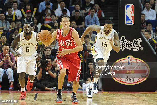 Pablo Prigioni of the Houston Rockets drives the ball against the New Orleans Pelicans during the pre-season game as part of the 2016 Global Games -...