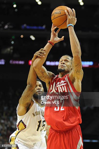 McDaniels of the Houston Rockets shoots the ball against Alonzo Gee of the New Orleans Pelicans during the pre-season game as part of the 2016 Global...