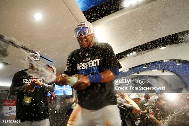 Edwin Encarnacion of the Toronto Blue Jays celebrates in the clubhouse after the Toronto Blue Jays defeated the Texas Rangers 7-6 for game three of...