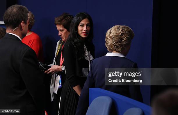 Hillary Clinton, 2016 Democratic presidential nominee, right, exits with aide Huma Abedin, center, after the second U.S. Presidential debate at...