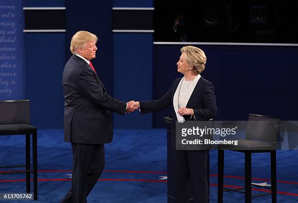 Donald Trump, 2016 Republican presidential nominee, shakes hands with Hillary Clinton, 2016 Democratic presidential nominee, on stage during the...