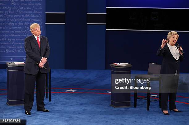 Donald Trump, 2016 Republican presidential nominee, gestures as Hillary Clinton, 2016 Democratic presidential nominee, speaks during the second U.S....