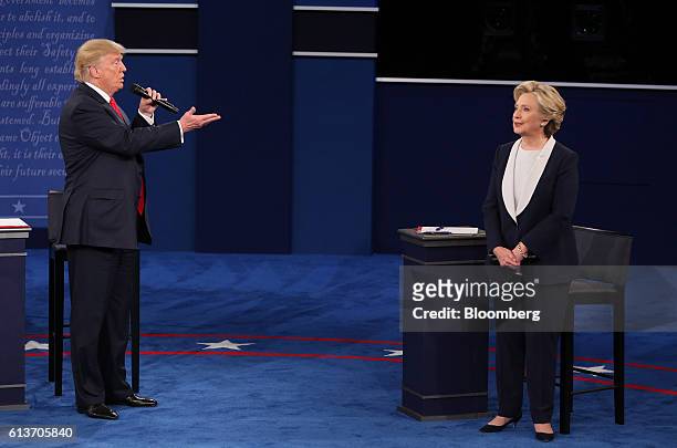 Donald Trump, 2016 Republican presidential nominee, speaks as Hillary Clinton, 2016 Democratic presidential nominee, listens during the second U.S....