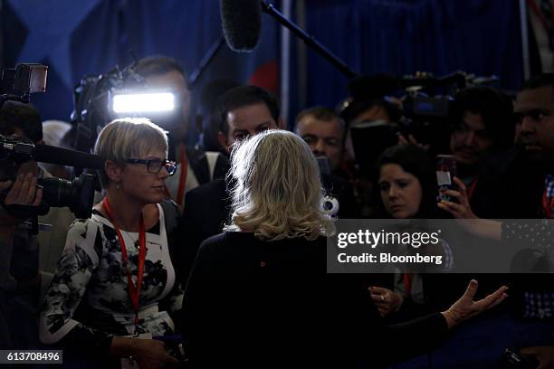 Juanita Broaddrick speaks to members of the media in the spin room after the second U.S. Presidential debate at Washington University in St. Louis,...