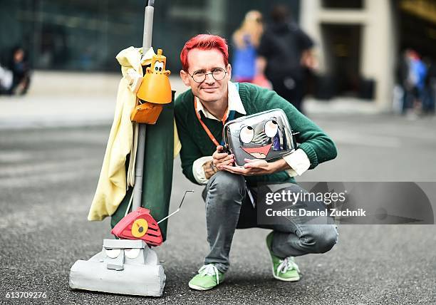 Comic Con attendee poses as characters from The Brave Little Toaster during the 2016 New York Comic Con - Day 4 on October 9, 2016 in New York City.