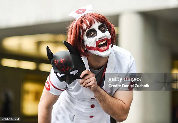 Comic Con attendee poses as The Joker during the 2016 New York Comic Con - Day 4 on October 9, 2016 in New York City.