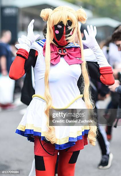 Comic Con attendee poses as a Sailor Moon Deadpool during the 2016 New York Comic Con - Day 4 on October 9, 2016 in New York City.