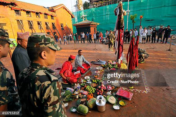 Nepalese priest offering ritual puja before prepares to slaughter on the occasion of Navami, ninth day of Dashain Festival at Basantapur Durbar...