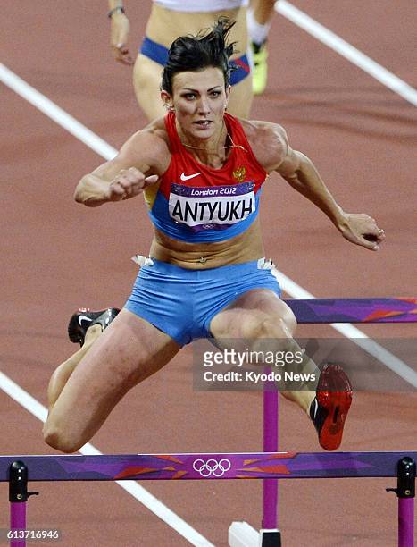 Britain - Russia's Natalya Antyukh competes in the women's 400-meter hurdles at the Olympic Stadium at the 2012 London Olympics on Aug. 8, 2012....
