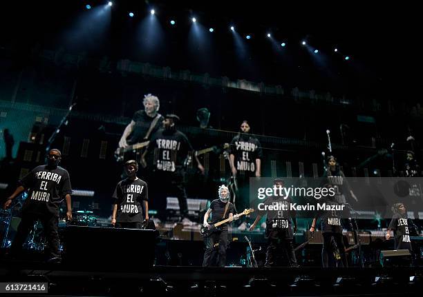 Musician Roger Waters performs with a children's choir wearing a T-shirt saying "derriba el muro" during Desert Trip at The Empire Polo Club on...