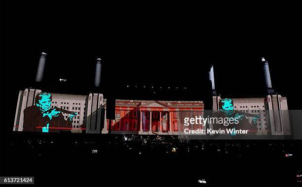 An illustration of Donald Trump appears on the screen during Roger Waters performance at Desert Trip at the Empire Polo Field on October 9, 2016 in...