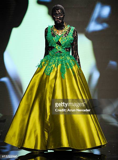 Model walks the runway wearing Kenneth Barlis at Art Hearts Fashion Los Angeles Fashion Week presented by AIDS Healthcare Foundation on October 9,...