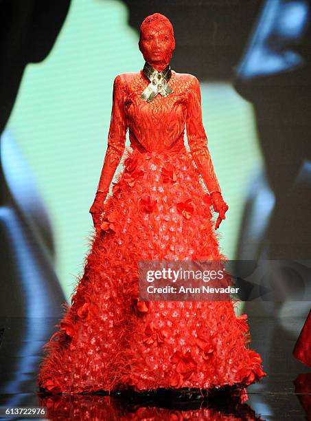 Model walks the runway wearing Kenneth Barlis at Art Hearts Fashion Los Angeles Fashion Week presented by AIDS Healthcare Foundation on October 9,...