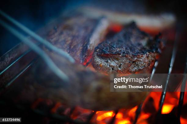 Schmorsdorf, Germany Beefsteaks lie on a grill on October 01, 2016 in Schmorsdorf, Germany.