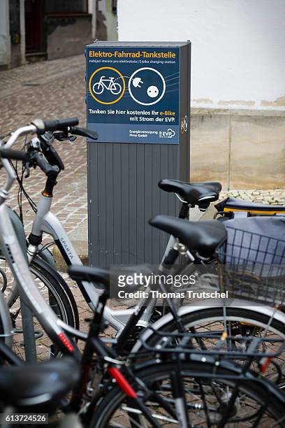 Pirna, Germany A charging station for e-bikes stands next to a bicycle rack on the market square of Pirna on October 02, 2016 in Pirna, Germany.