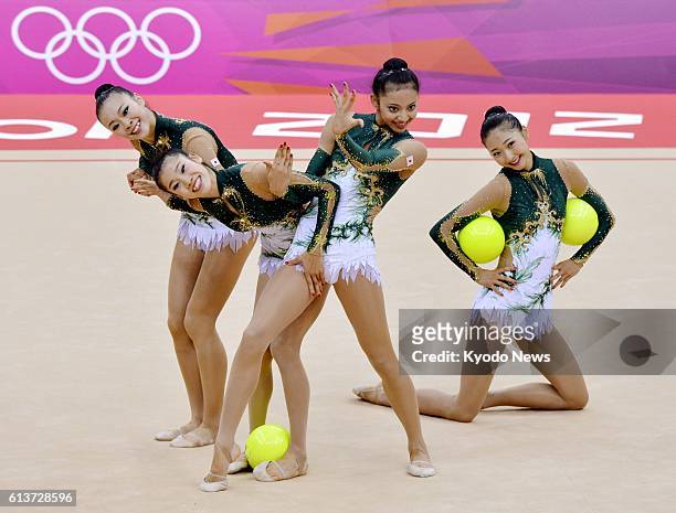 Britain - Japan's Natsuki Fukase, Rie Matsubara, Nina Saeed Yokota and Airi Hatakeyama perform with balls during the rhythmic gymnastics team final...