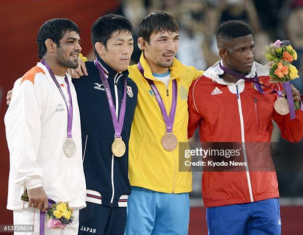 Britain - Japan's gold medalist Tatsuhiro Yonemitsu , India's silver medalist Sushil Kumar , Kazakhstan's bronze medalist Akzhurek Tanatarov , and...