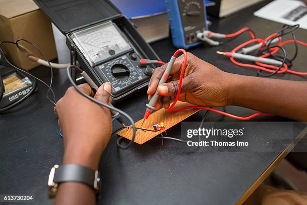 Accra, Ghana Girls Vocational Training Institute, a vocational school in which African girls are trained in electrical engineering. Here, a student...