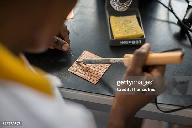 Accra, Ghana Girls Vocational Training Institute, a vocational school where girls are taught in electrical engineering. Here a student is practicing...