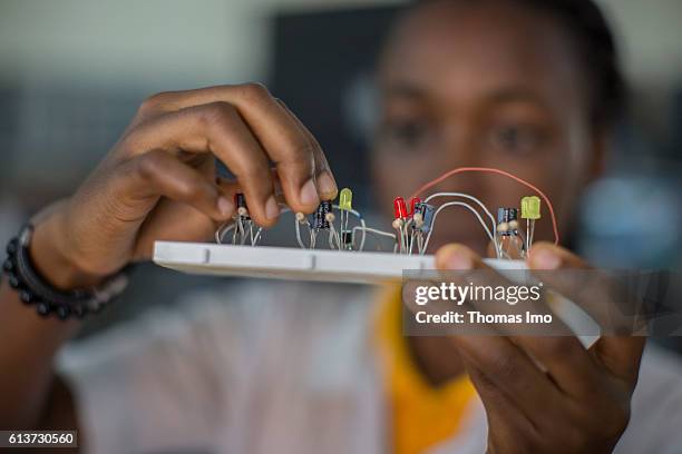 Accra, Ghana Girls Vocational Training Institute, a vocational school where girls are taught in electrical engineering. Here a pupil poses with a...