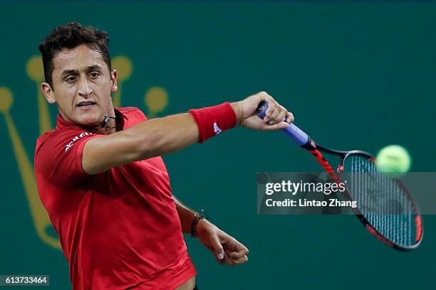 Nicolas Almagro of Spain returns a shot against Mikhail Youzhny of Russia during the Men's singles first round match on day two of Shanghai Rolex...