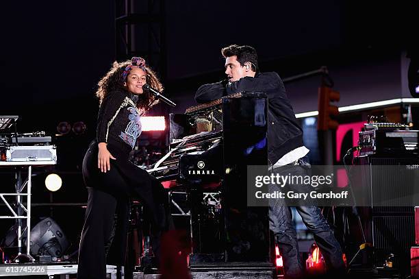 Alicia Keys and John Mayer perform in Times Square on October 9, 2016 in New York City.