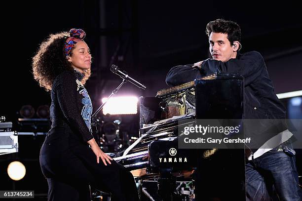 Alicia Keys and John Mayer perform in Times Square on October 9, 2016 in New York City.